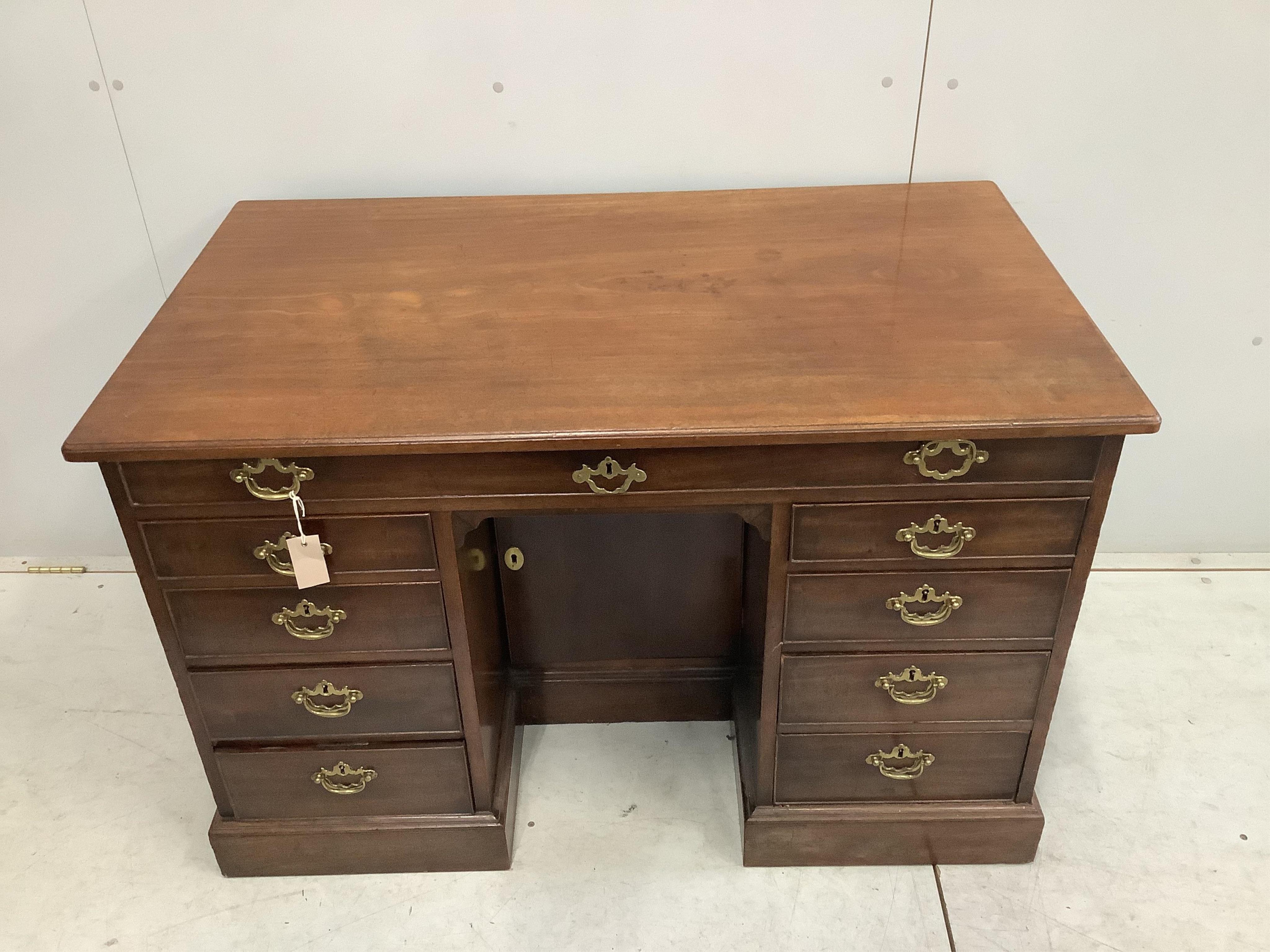 A George III mahogany kneehole desk, width 117cm, depth 67cm, height 74cm. Condition - fair to good